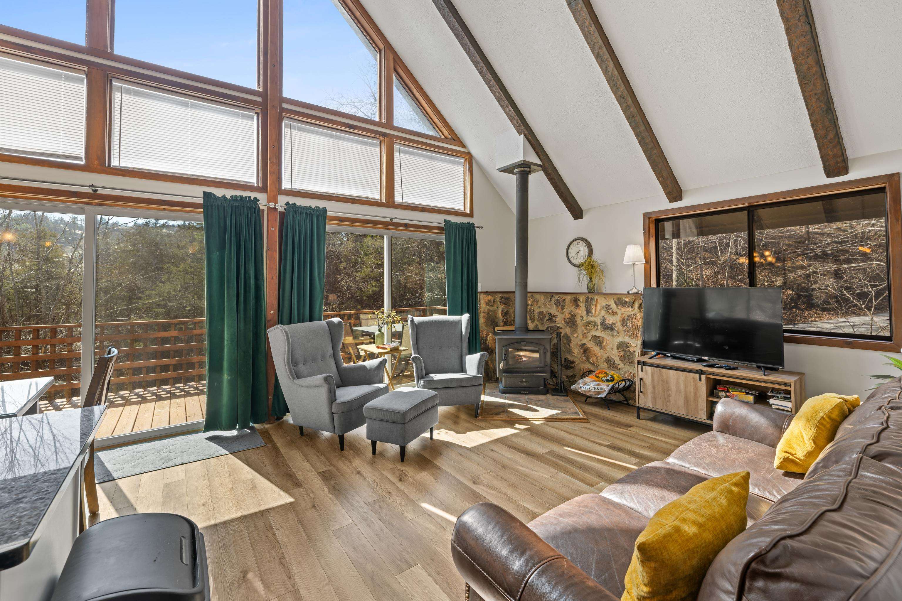 673 Killmon Road Basye, VA 22810 - Photo 48 of 74 a living room with furniture or outdoor view and a large window