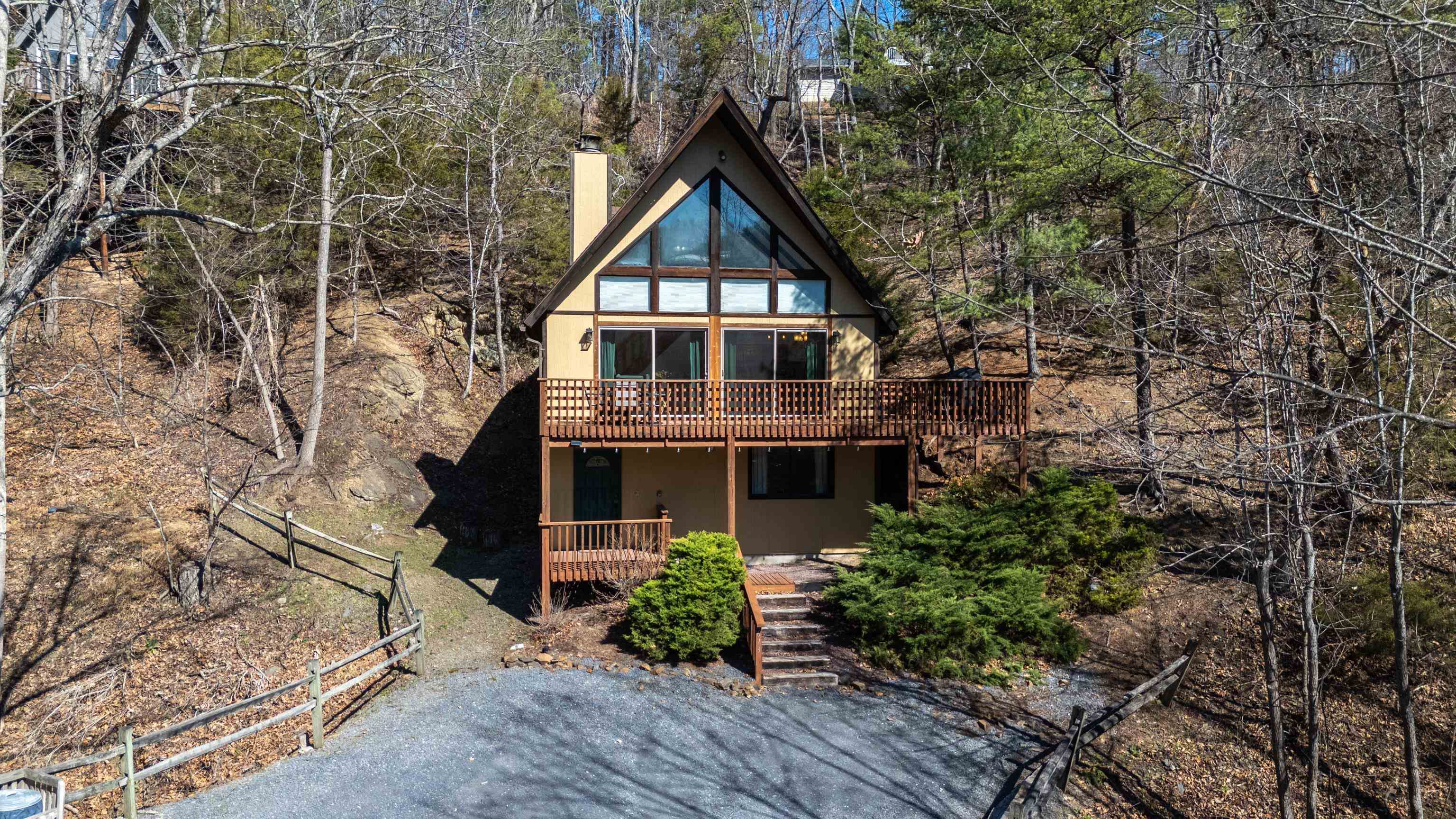 673 Killmon Road Basye, VA 22810 - Photo 73 of 74 a front view of a house with plants and trees