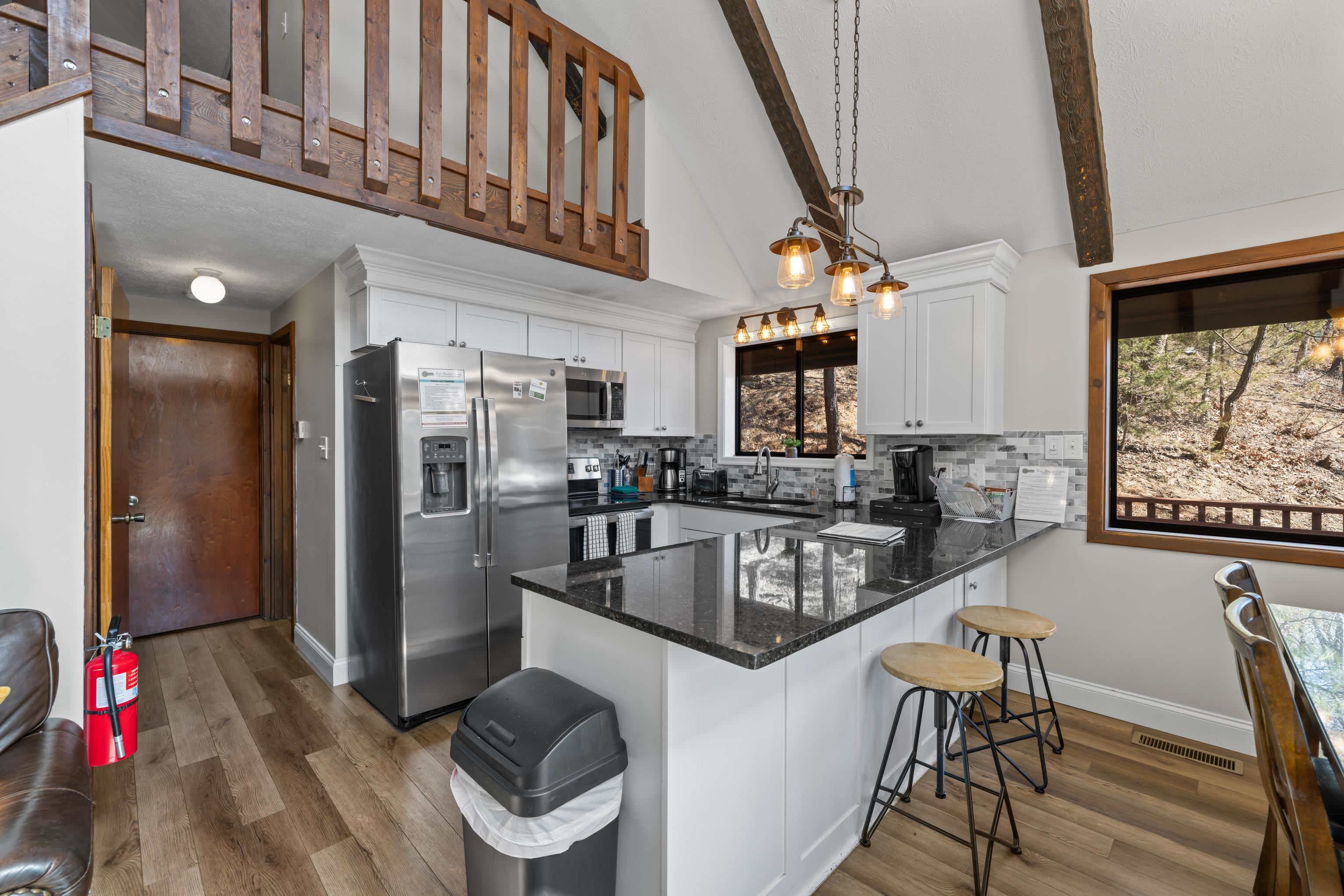 673 Killmon Road Basye, VA 22810 - Photo 10 of 74 a kitchen with granite countertop lots of counter top space and stainless steel appliances