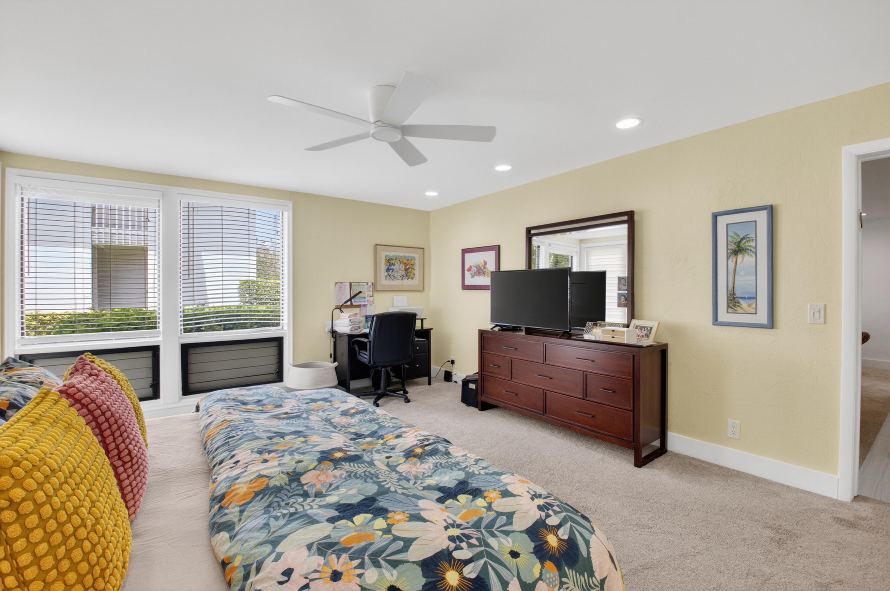 19981 Boca W Drive, Unit 3123 Boca Raton, FL 33434 - Photo 17 of 57 a bedroom with furniture and a flat screen tv