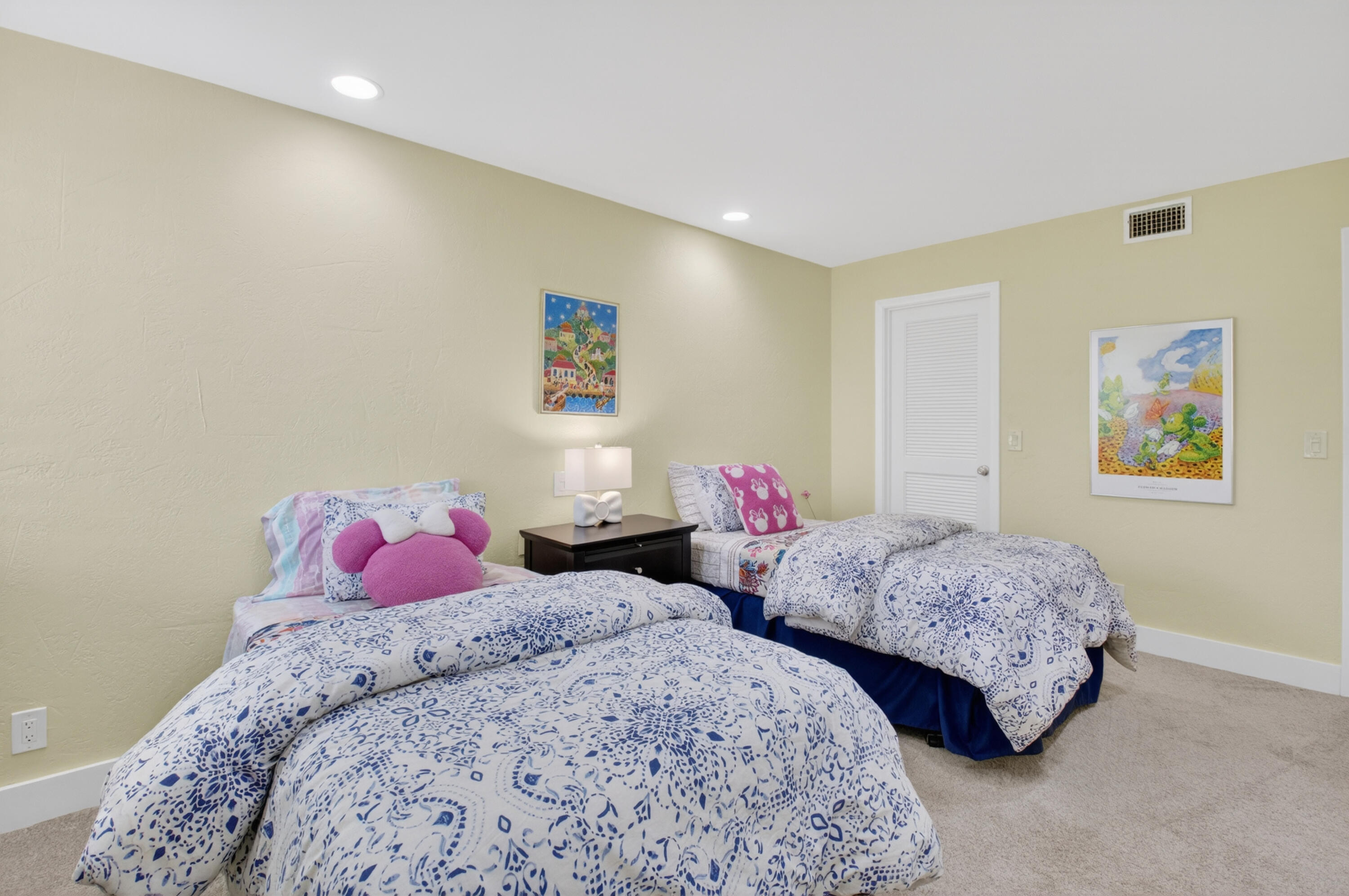 19981 Boca W Drive, Unit 3123 Boca Raton, FL 33434 - Photo 21 of 57 a bedroom with two beds and a painting on the wall