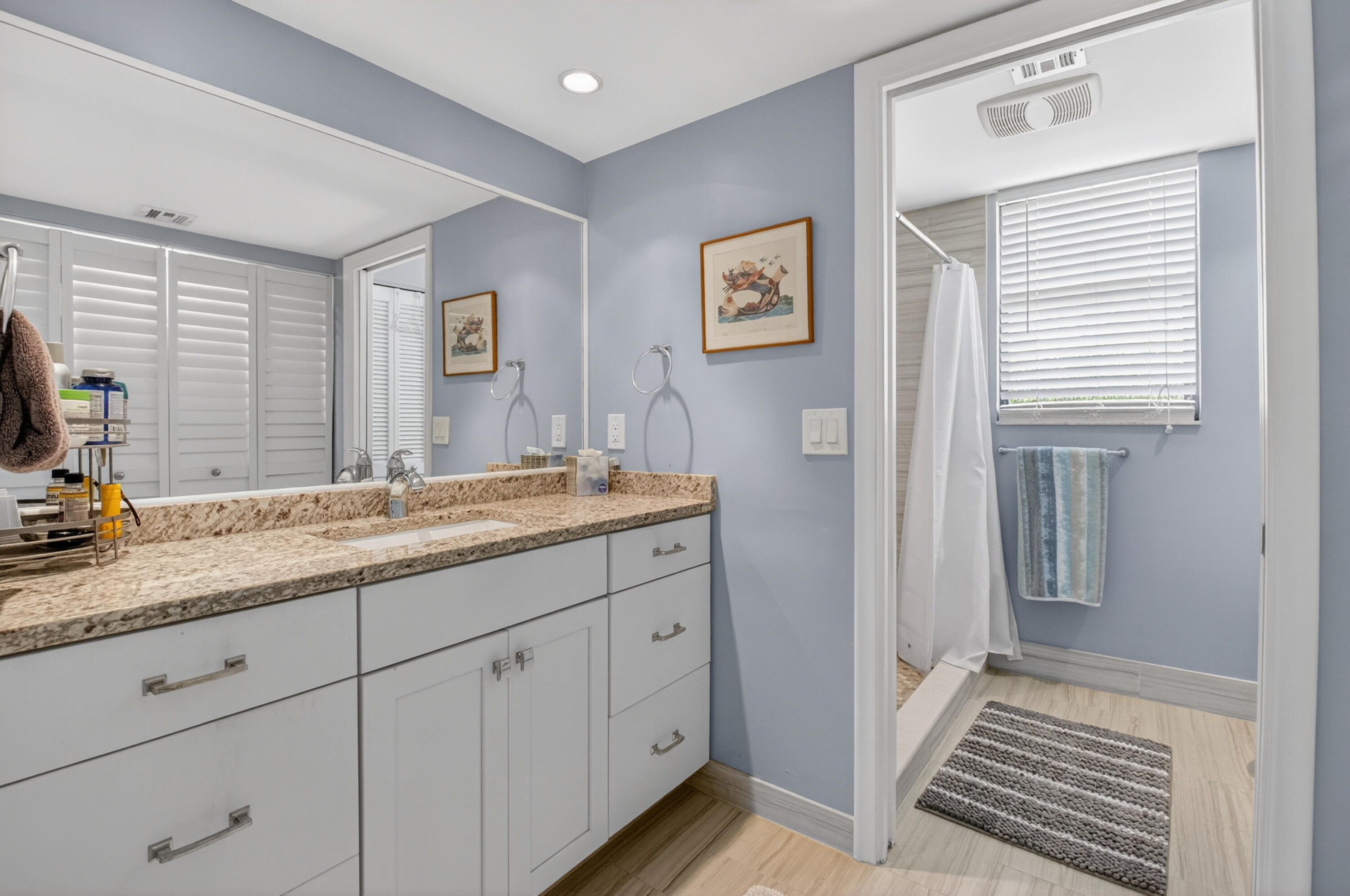 19981 Boca W Drive, Unit 3123 Boca Raton, FL 33434 - Photo 4 of 57 a bathroom with a granite countertop sink and a window