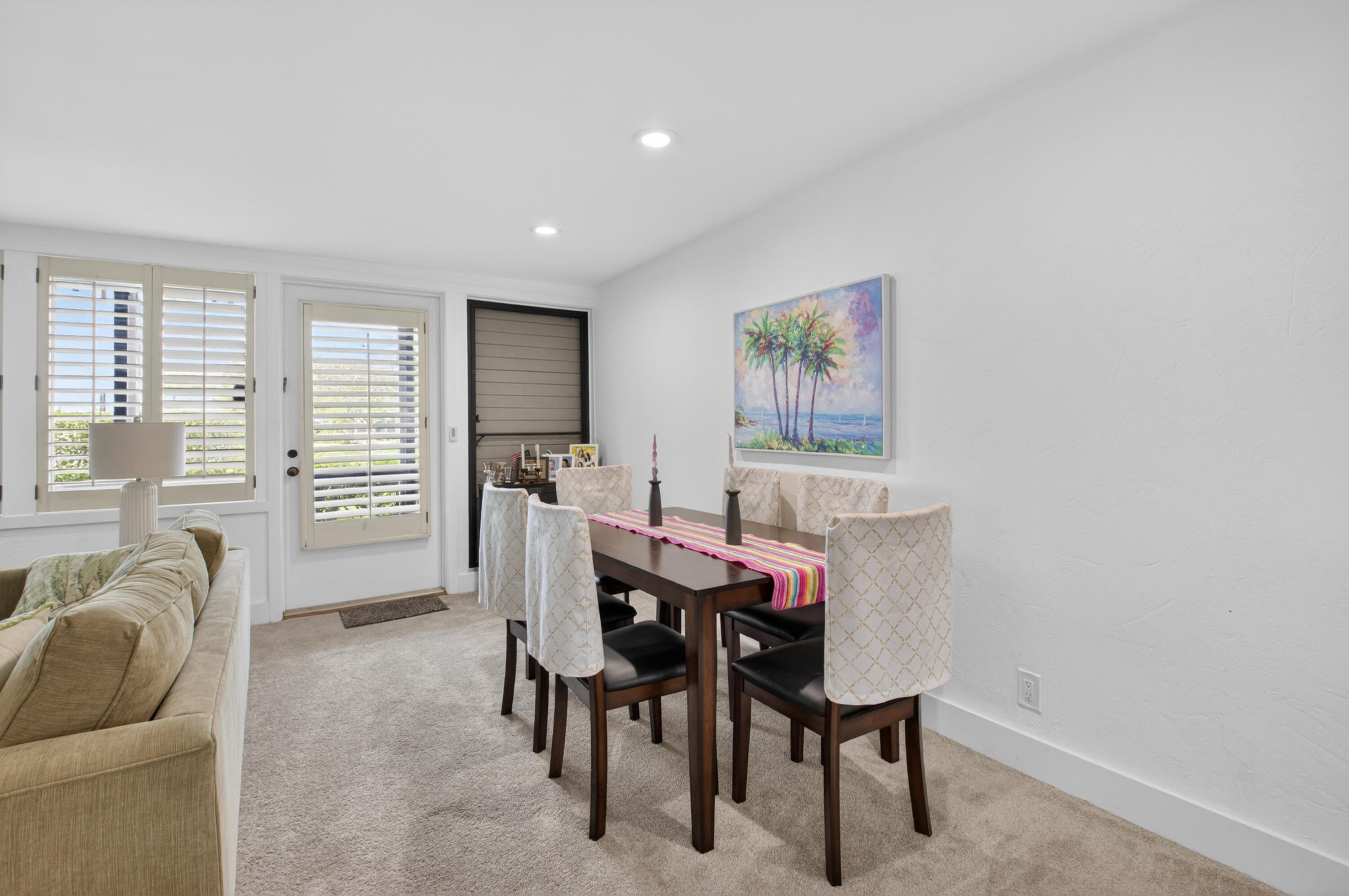 19981 Boca W Drive, Unit 3123 Boca Raton, FL 33434 - Photo 9 of 57 a view of a dining room with furniture and a large window