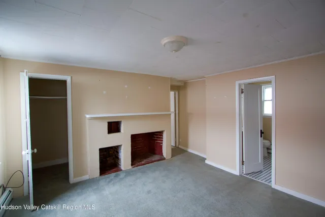 an empty room with fireplace