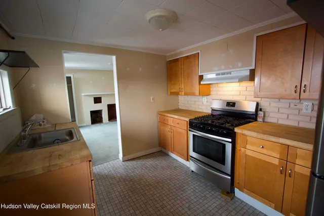 a kitchen with a stove and a sink
