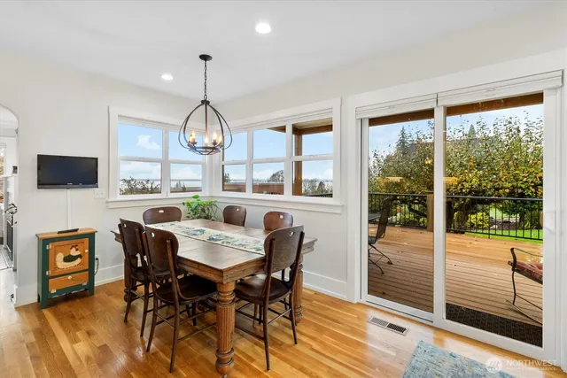 a view of a dining room with furniture window and wooden floor
