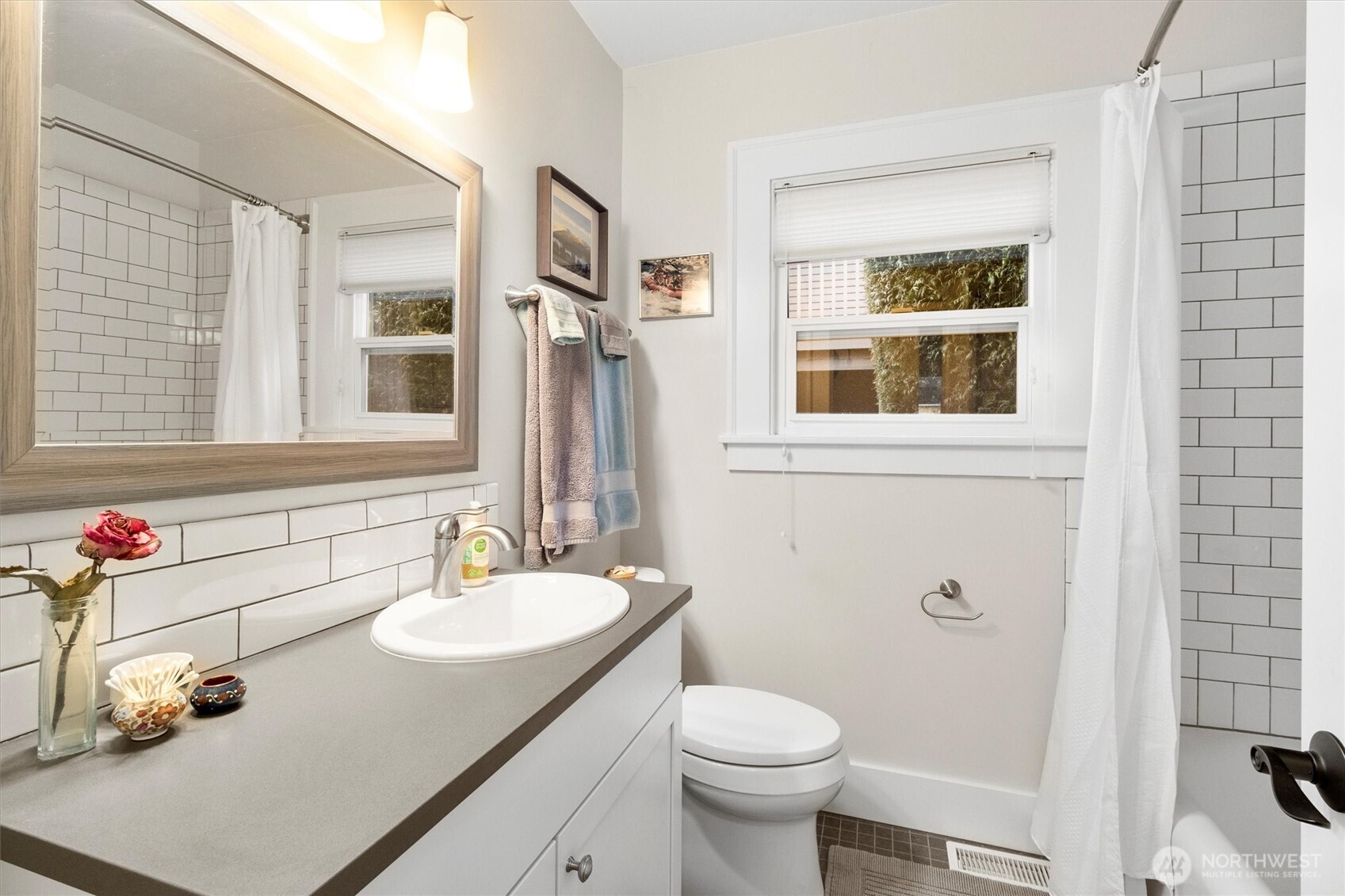 925 15th Street Bellingham, WA 98225 - Photo 15 of 40 a bathroom with a sink toilet and shower