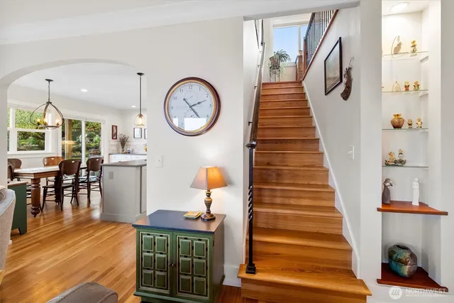 a view of entryway and hall with wooden floor