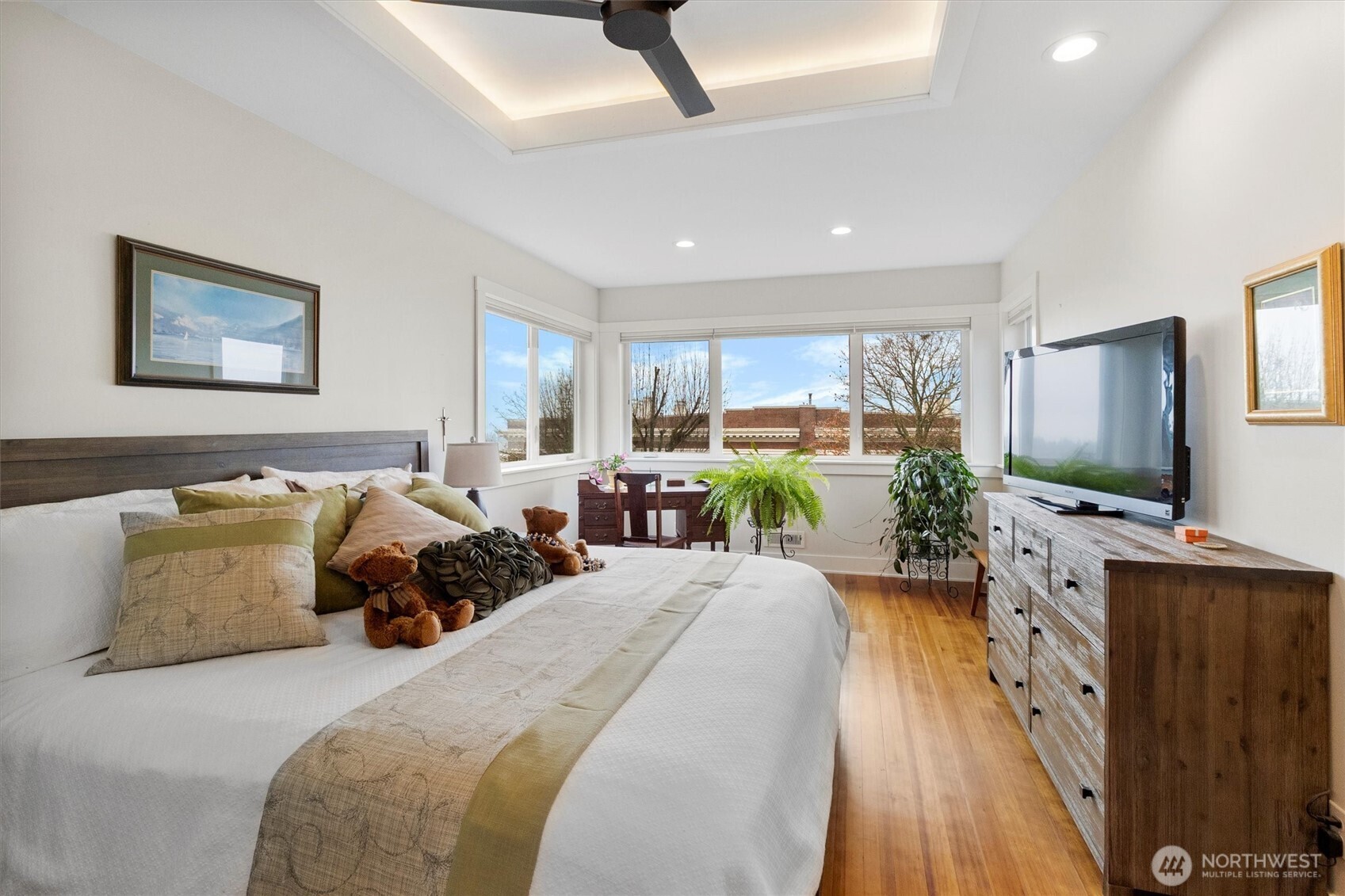 925 15th Street Bellingham, WA 98225 - Photo 20 of 40 a large bedroom with a bed and a flat screen tv