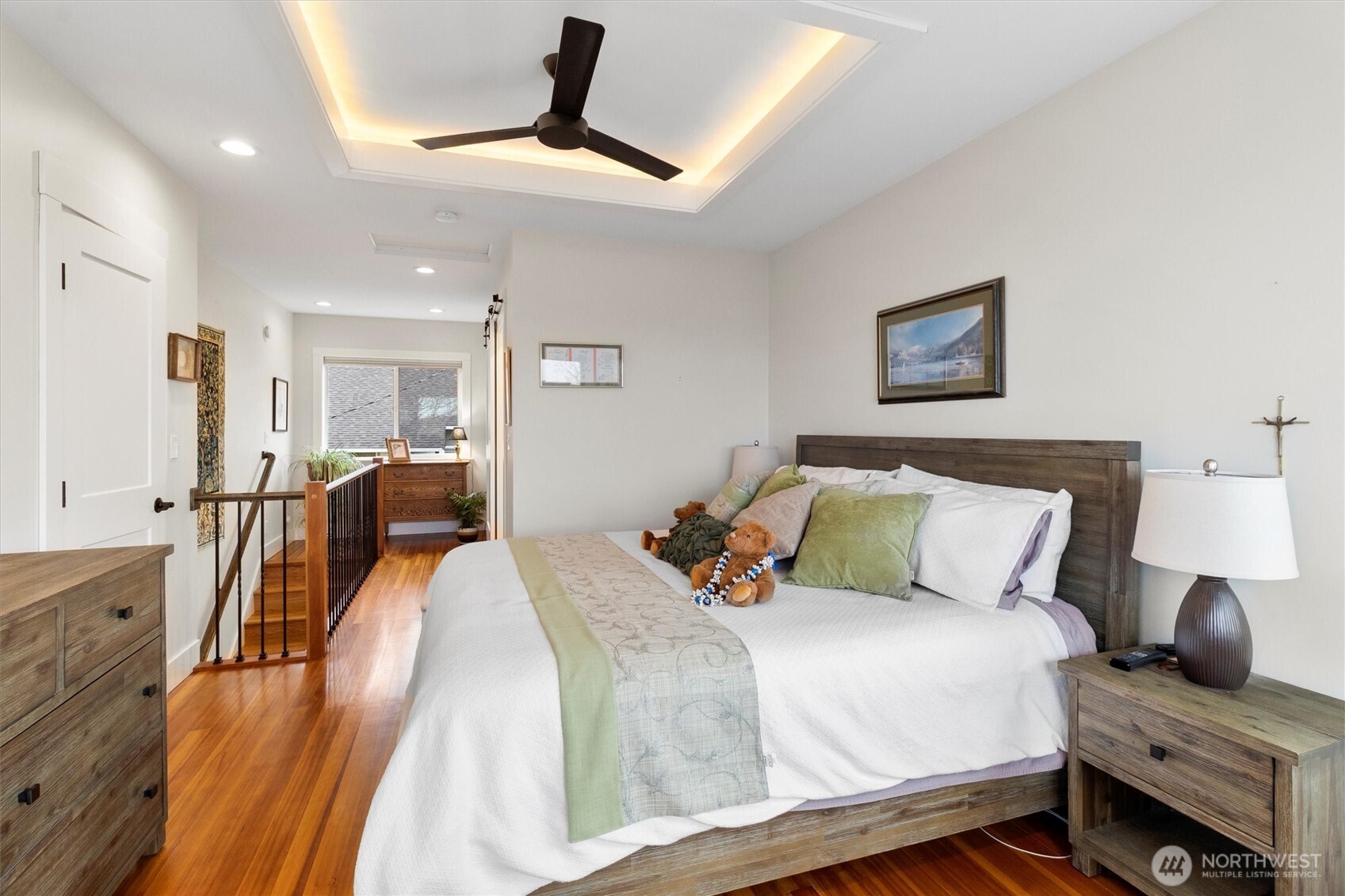 925 15th Street Bellingham, WA 98225 - Photo 21 of 40 a bedroom with a bed and a chandelier