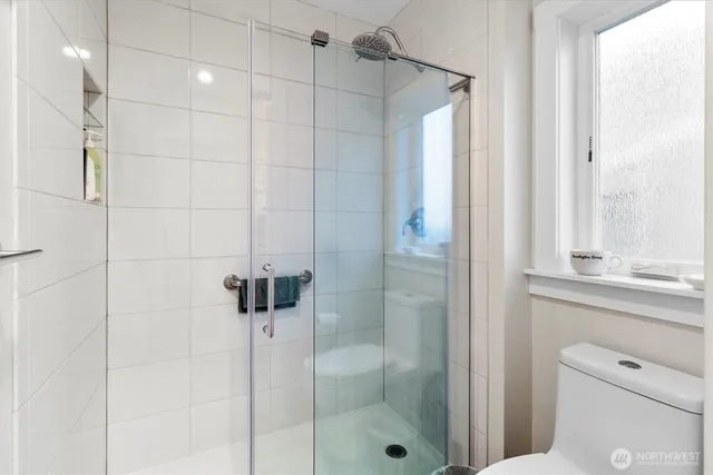 a bathroom with a shower and a sink