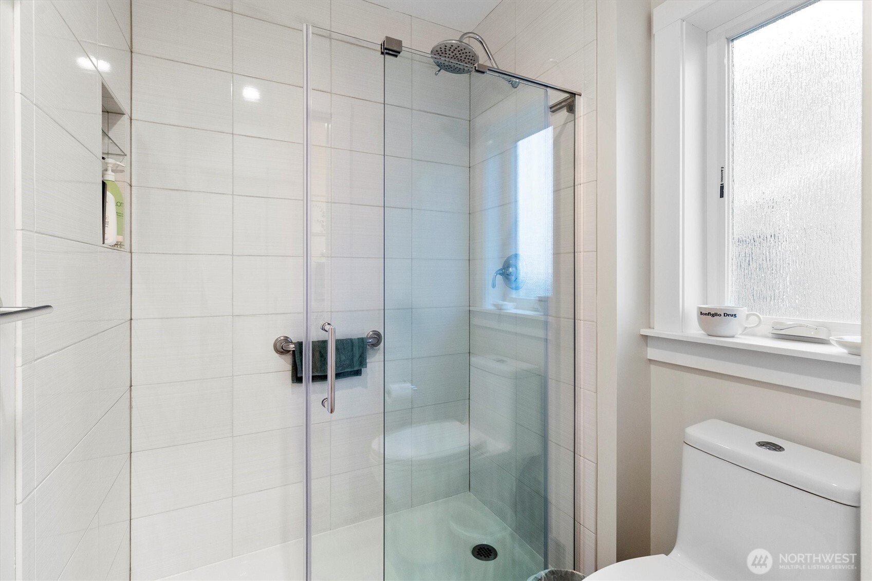 925 15th Street Bellingham, WA 98225 - Photo 29 of 40 a bathroom with a shower and a sink