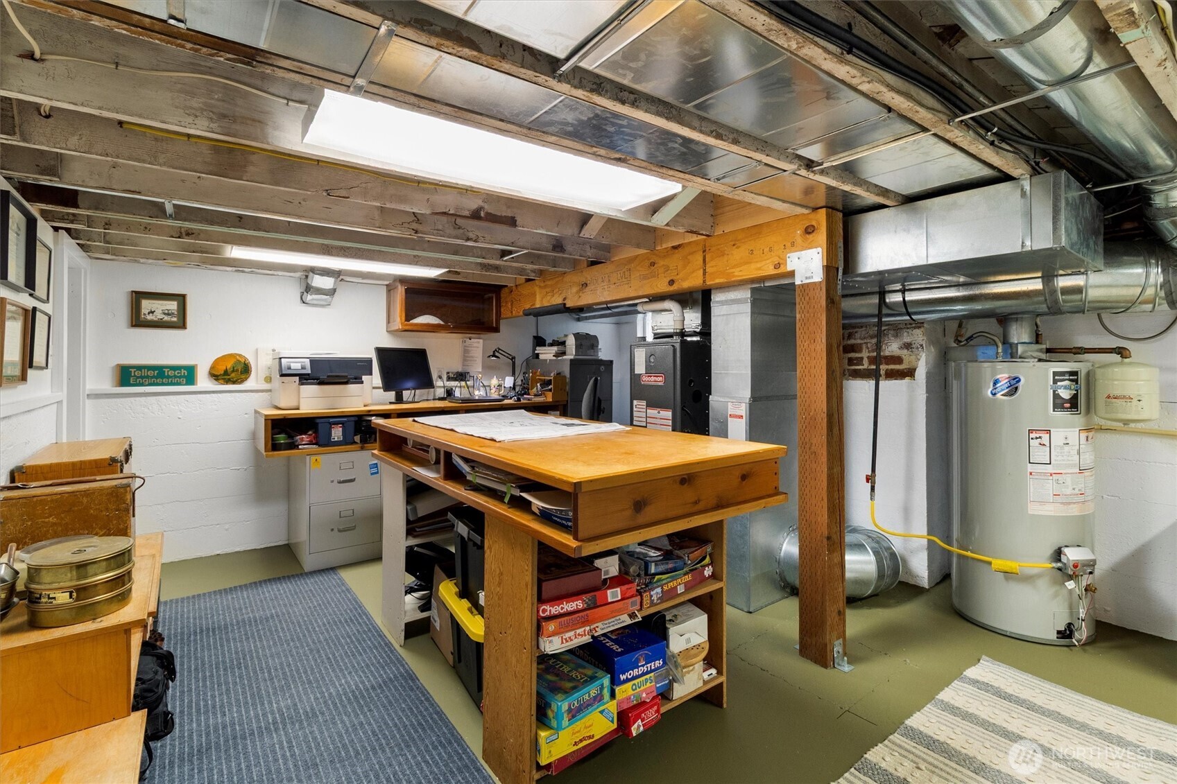925 15th Street Bellingham, WA 98225 - Photo 30 of 40 a utility room with stainless steel appliances kitchen island granite countertop a sink a stove and a wooden floors