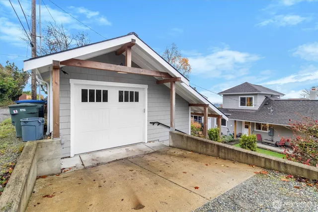 a front view of a house with large windows