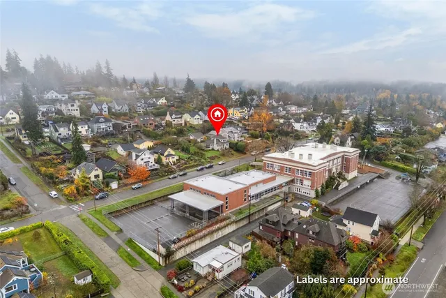 an aerial view of residential houses with outdoor space