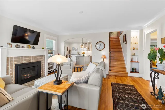 a living room with furniture fireplace and flat screen tv