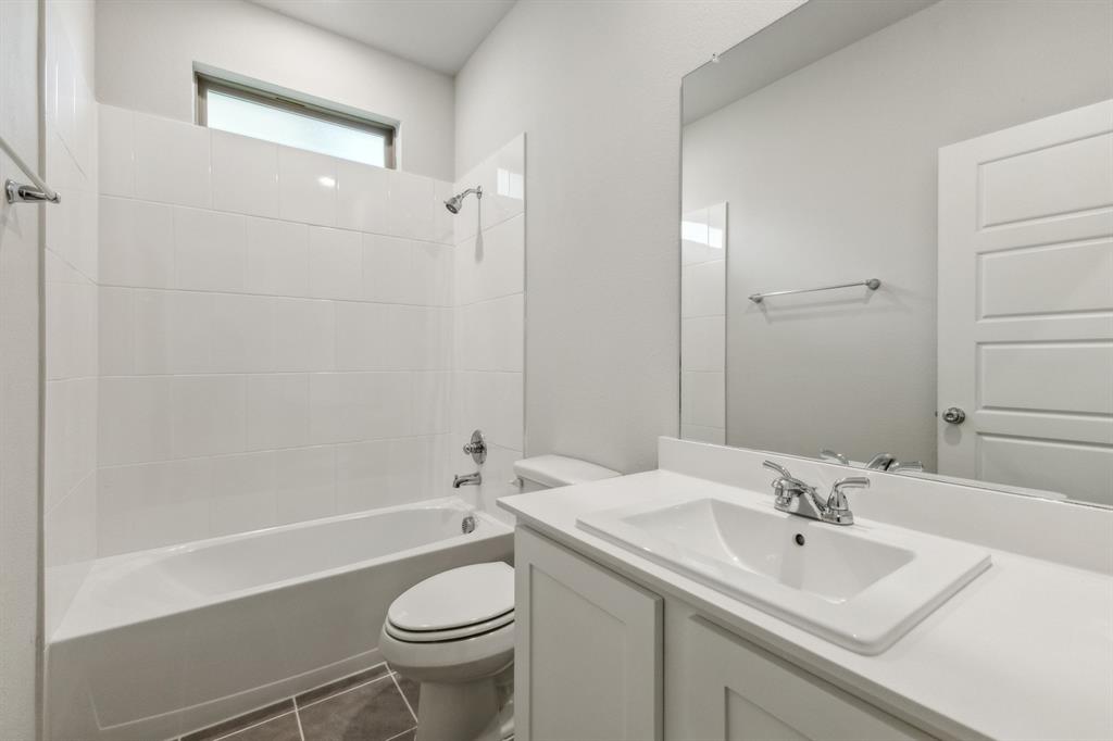 136 Millwood Road Lavon, TX 75166 - Photo 18 of 21 Bathroom in the Cedar home plan by Trophy Signature Homes – REPRESENTATIVE PHOTO