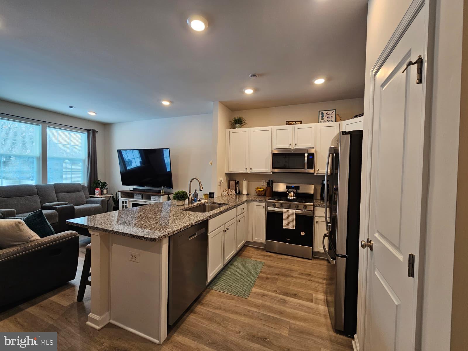 33 Alexander Way Westampton, NJ 08060 - Photo 3 of 18 a large kitchen with stainless steel appliances kitchen island granite countertop a refrigerator and a stove top oven