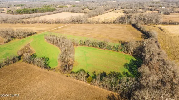 a view of a lake with a big yard