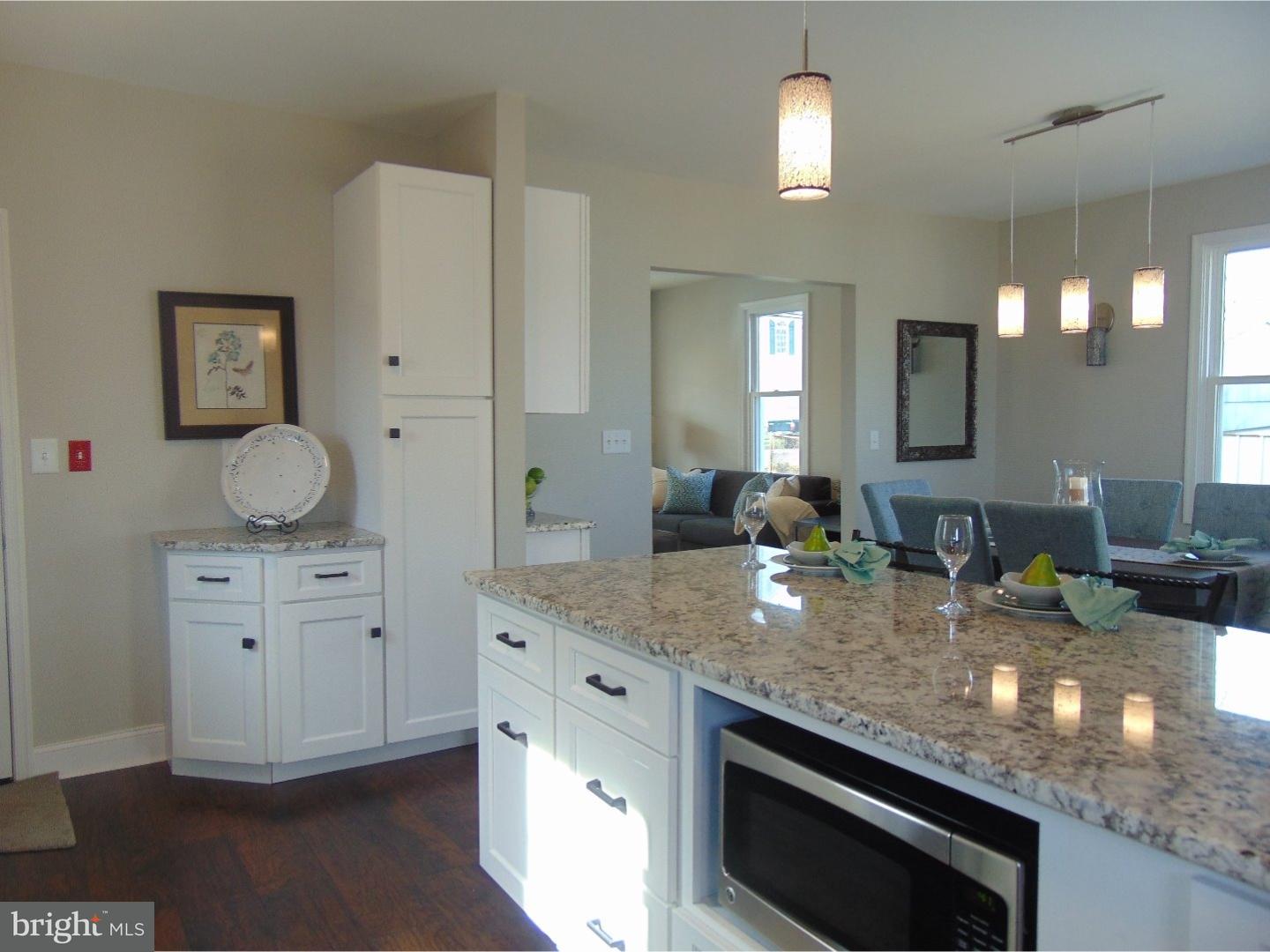 124 Ronald Road Aston, PA 19014 - Photo 5 of 25 a kitchen with sink stove and microwave