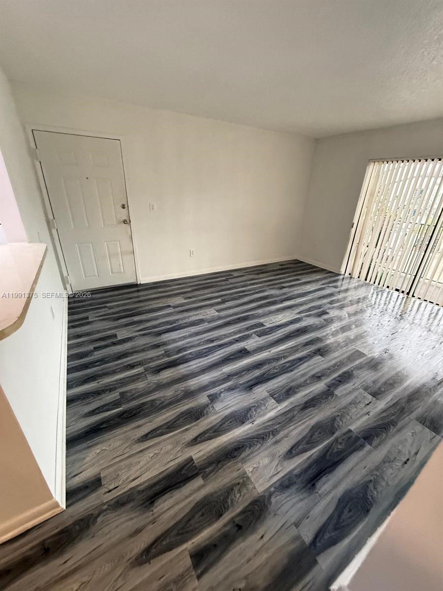 7210 Northwest 179th Street, Unit 203 Hialeah, FL 33015 - Photo 12 of 16 a view of wooden floor