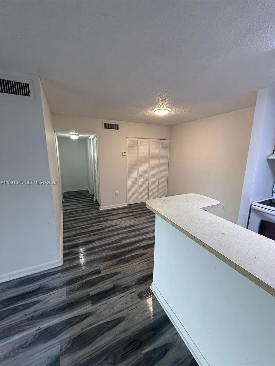 7210 Northwest 179th Street, Unit 203 Hialeah, FL 33015 - Photo 14 of 16 a view of a hallway with stairs