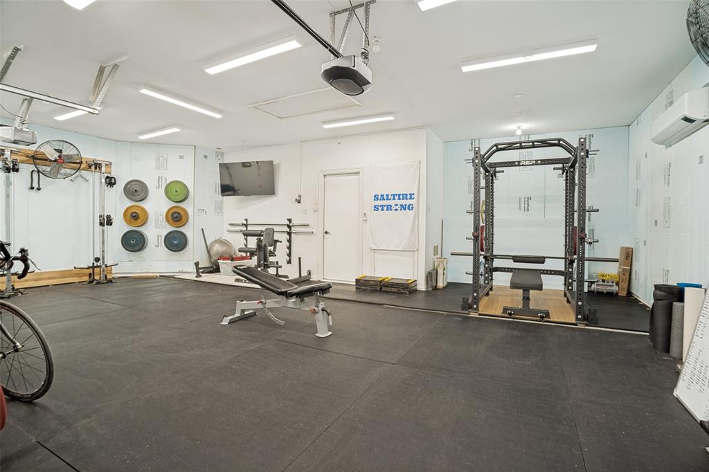 1612 Coventry Lane Allen, TX 75002 - Photo 19 of 39 Dedicated fitness space featuring rubberized flooring and a power rack with a raised platform