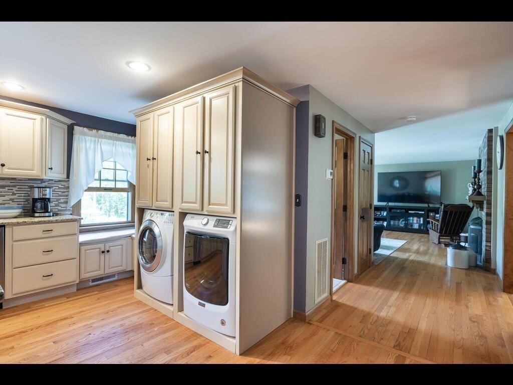 151 Ames Road Hampden, MA 01036 - Photo 12 of 41 a kitchen with stainless steel appliances granite countertop a refrigerator a stove and a sink with wooden floor