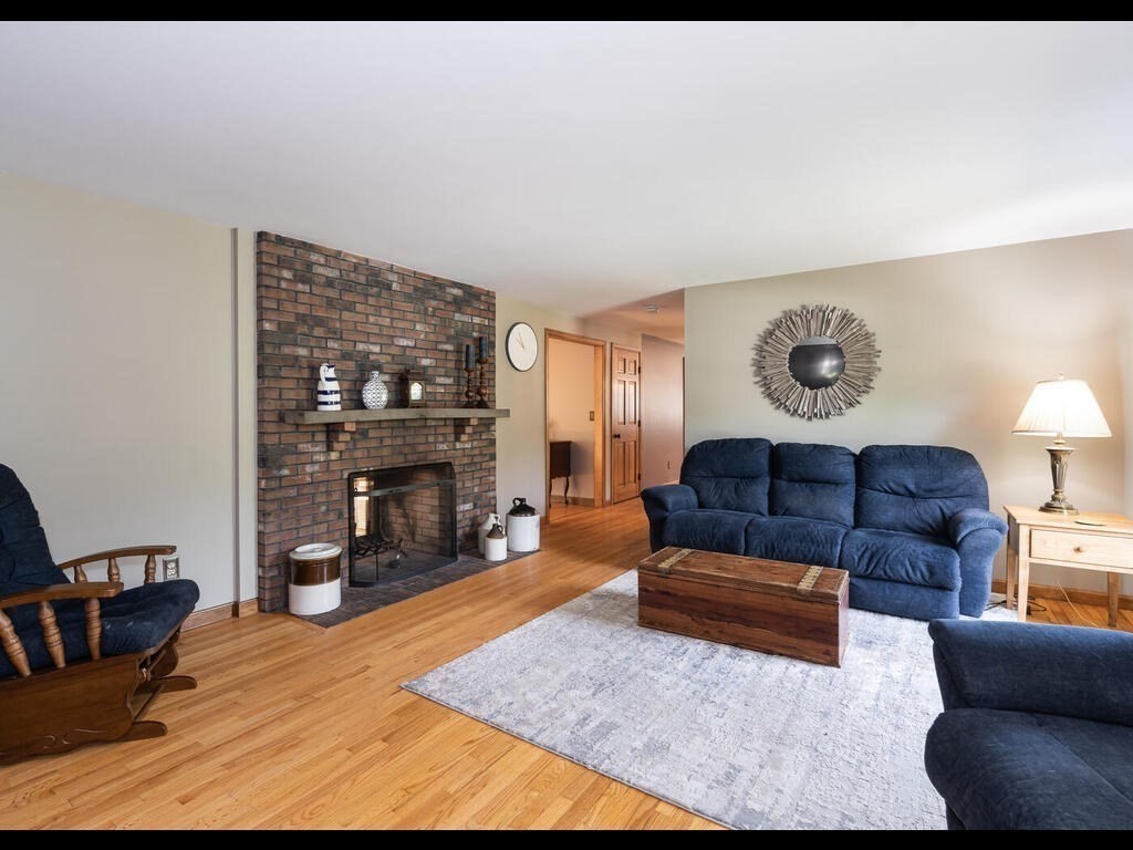 151 Ames Road Hampden, MA 01036 - Photo 14 of 41 a living room with furniture and a fireplace