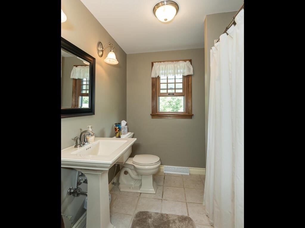 151 Ames Road Hampden, MA 01036 - Photo 17 of 41 a bathroom with a sink toilet and a mirror