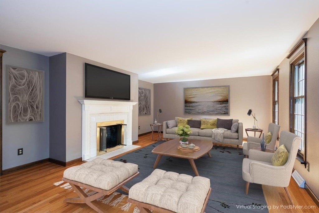 151 Ames Road Hampden, MA 01036 - Photo 19 of 41 a living room with furniture a fireplace and a flat screen tv