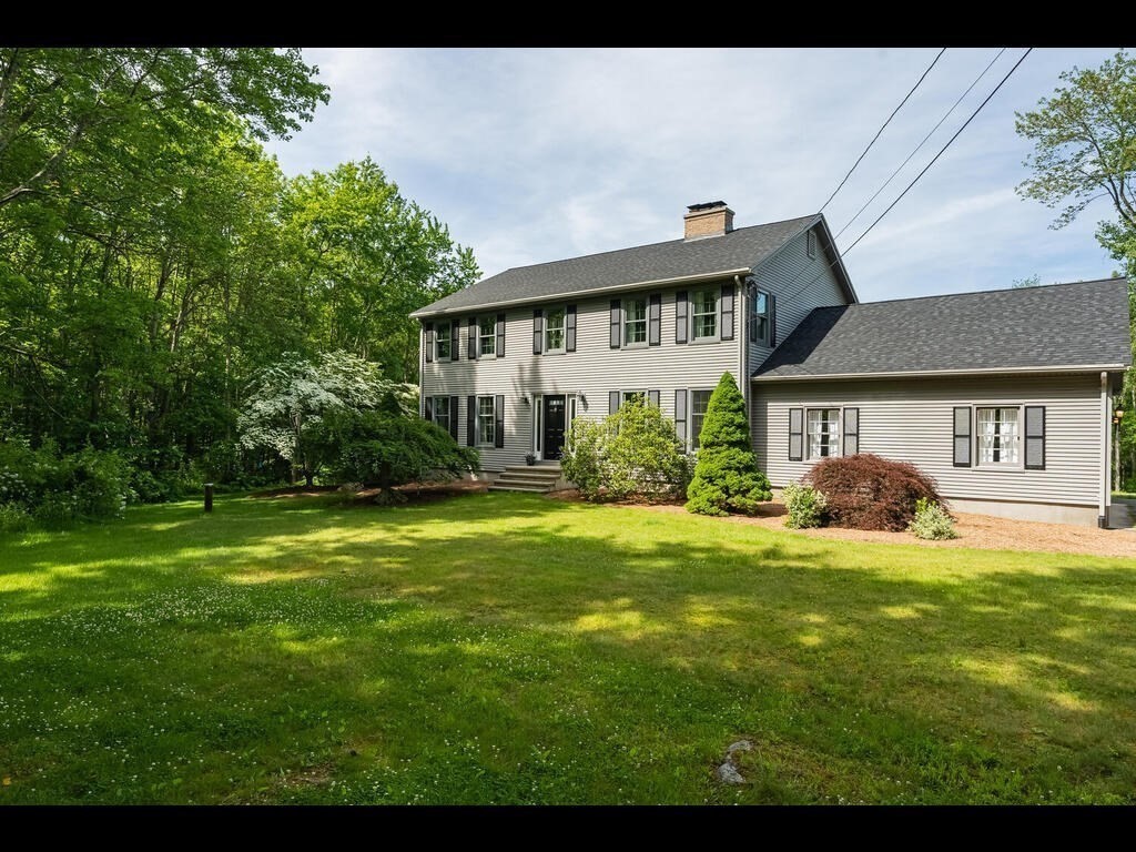 151 Ames Road Hampden, MA 01036 - Photo 2 of 41 a front view of a house with a garden