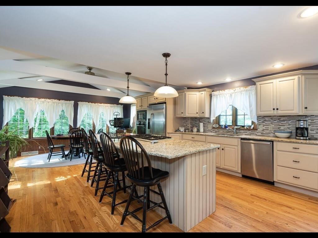 151 Ames Road Hampden, MA 01036 - Photo 4 of 41 a dining hall with stainless steel appliances granite countertop a stove and a view of living room
