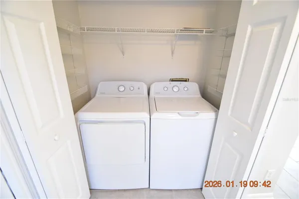 a utility room with dryer and washer