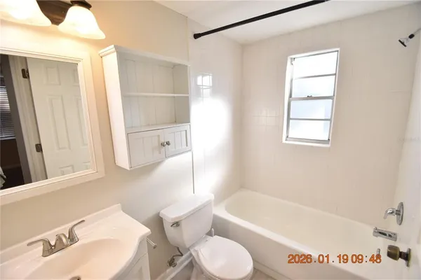 a bathroom with a sink a toilet and a bathtub