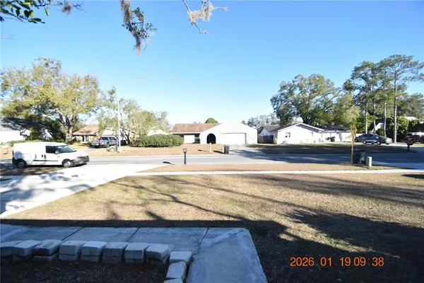 a view of a swimming pool with an outdoor seating