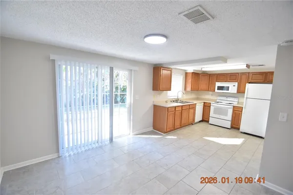 a kitchen with stainless steel appliances a refrigerator and a sink