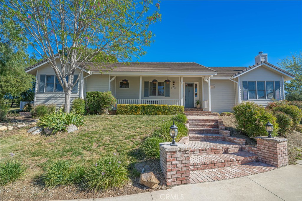 11340 Morgan Road Agua Dulce, CA 91390 - Photo 1 of 60 a front view of a house with garden