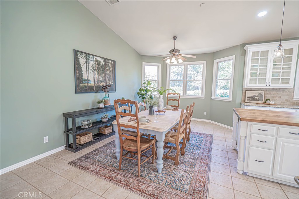 11340 Morgan Road Agua Dulce, CA 91390 - Photo 15 of 60 a dining room with furniture a rug and wooden floor