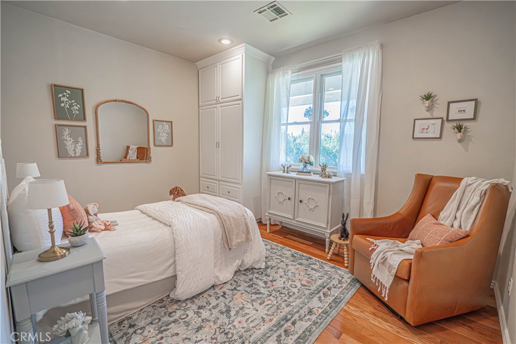 11340 Morgan Road Agua Dulce, CA 91390 - Photo 25 of 60 a bedroom with a bed and wooden floor