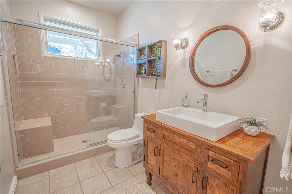 11340 Morgan Road Agua Dulce, CA 91390 - Photo 26 of 60 a bathroom with a sink a toilet and shower