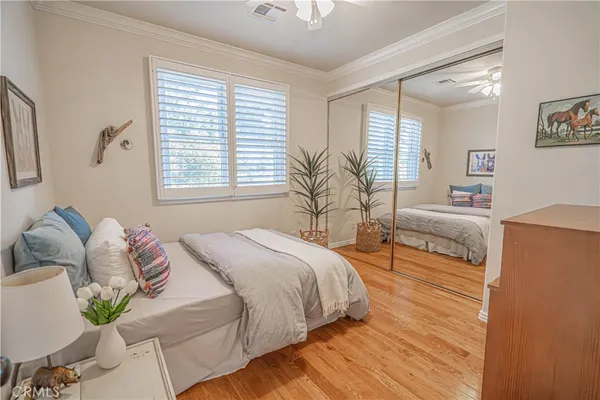 a living room with furniture a large window and a chandelier