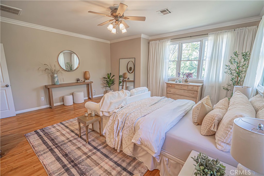 11340 Morgan Road Agua Dulce, CA 91390 - Photo 33 of 60 a bedroom with a bed and a chandelier