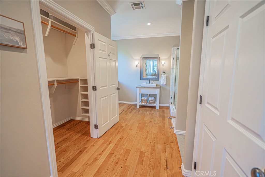 11340 Morgan Road Agua Dulce, CA 91390 - Photo 36 of 60 a view of a hallway with wooden floor and closet