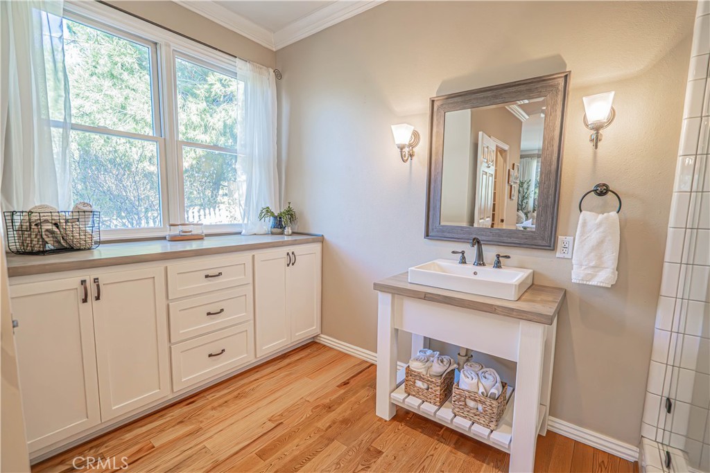 11340 Morgan Road Agua Dulce, CA 91390 - Photo 38 of 60 a room with a sink and a mirror