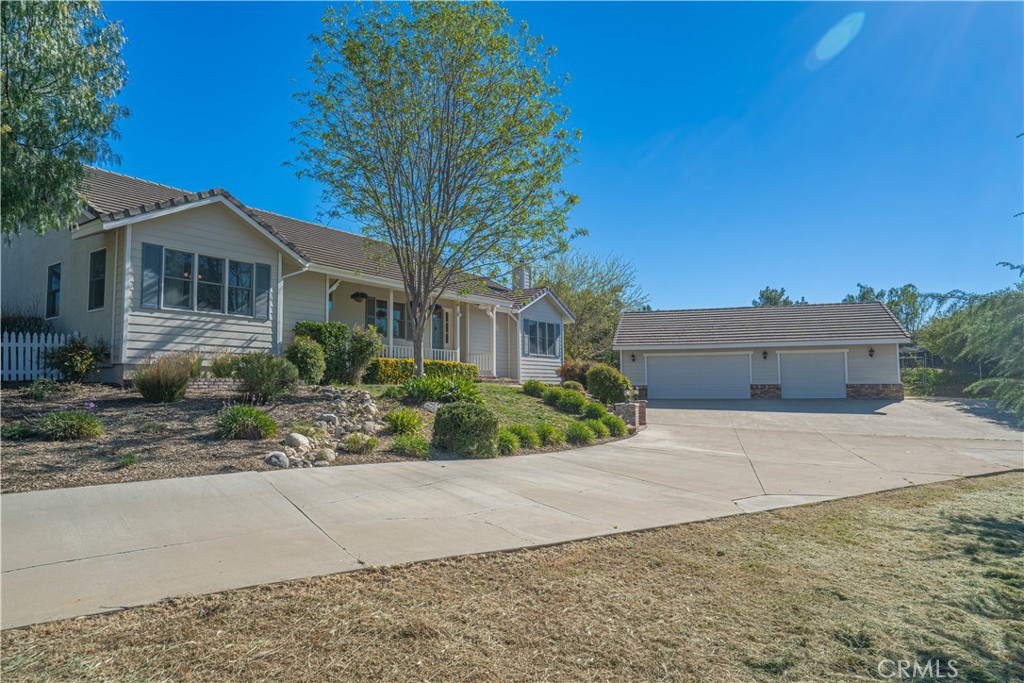 11340 Morgan Road Agua Dulce, CA 91390 - Photo 4 of 60 a front view of a house with a yard