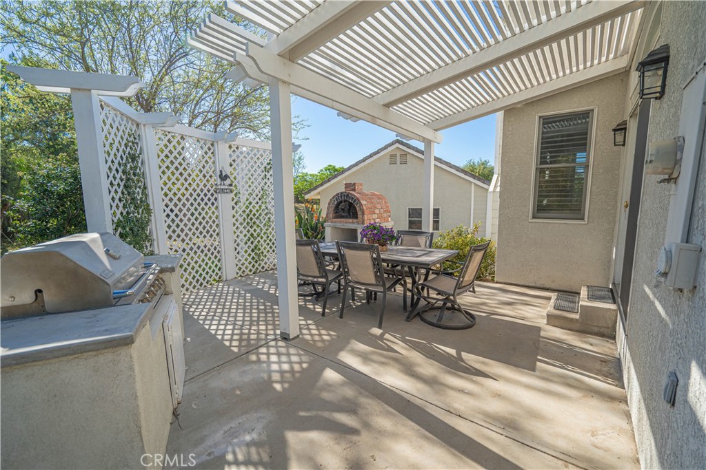 11340 Morgan Road Agua Dulce, CA 91390 - Photo 43 of 60 a view of a patio with a table and chairs