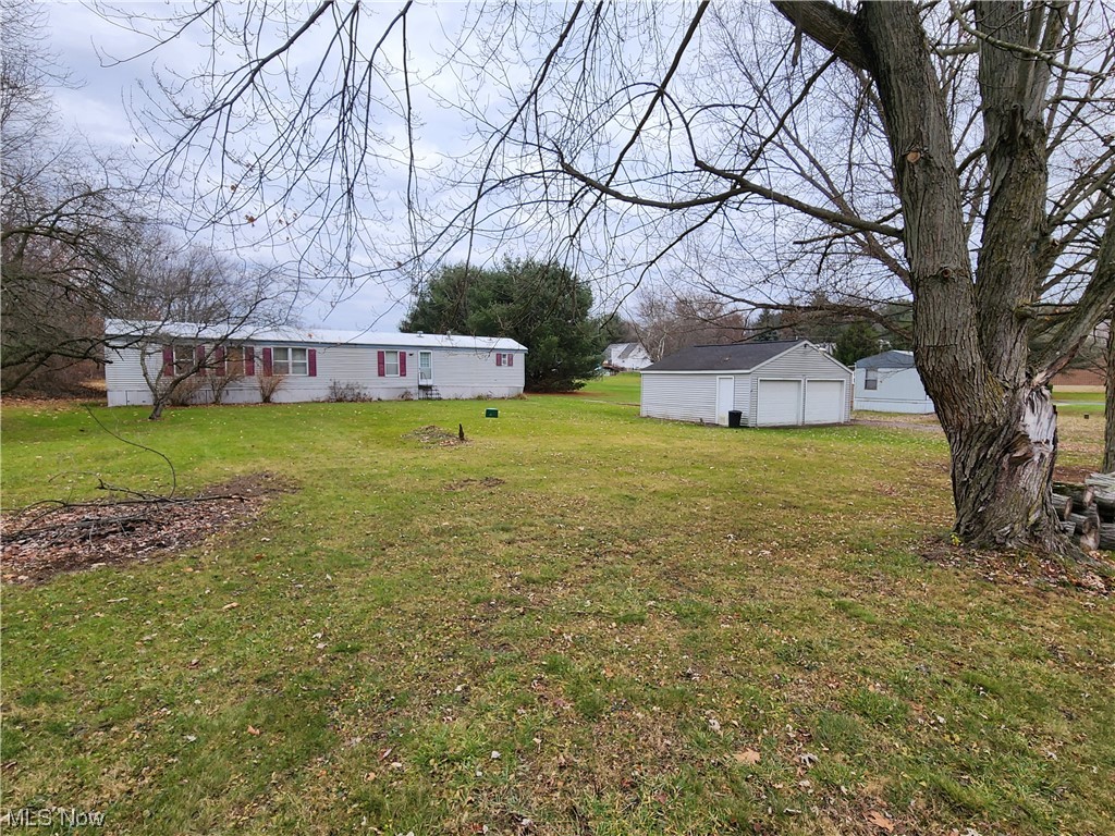 3895 Middletown Road East Youngstown, OH 44514 - Photo 3 of 28 View of yard featuring a garage