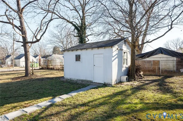 a view of a house with a yard covered with snow in front of house