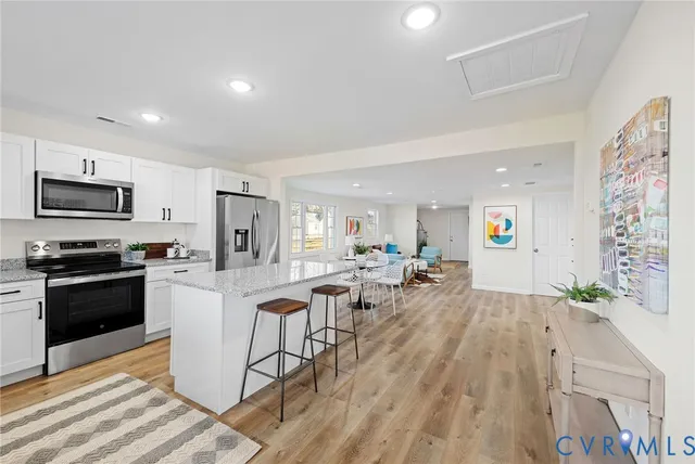 a view of a kitchen and dining room